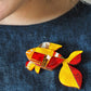 A Goldfish Named Silence Brooch (2024) by Erstwilder and Clare Youngs