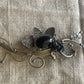 Artisan Wirework Brooch with Black Cabochon – Sculptural Design