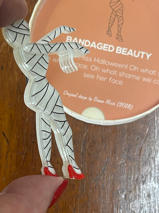 Bandaged Beauty Mummy Brooch (2018 ) by Erstwilder