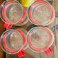 Set of Four Bodum Denmark glass coffee or tea mugs with Red Handles