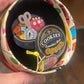 Erstwilder “Cookie Tin Secrets” Brooch – Arts & Crafts Collection (2026)