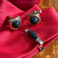 Vintage gold tone cuff links and tie clip with dark green stone