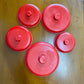 Set of five vintage c.1950s red and cream Bakelite canisters by Eon