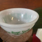 White Pyrex bowl with green grape leaf design 1960s